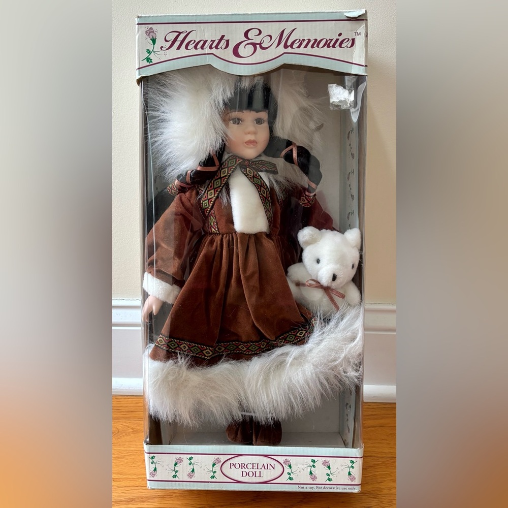 Brown and White Doll with Bear